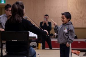 Young child conducts a string quartet of OSM musicians