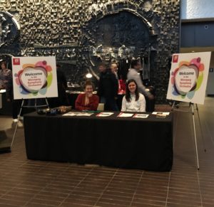 Photo of two volunteers in the lobby of the hall before the concert